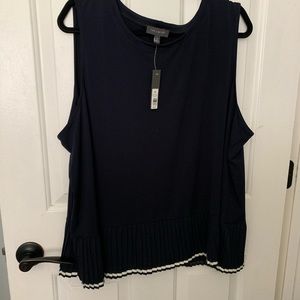 The limited sleeveless top, pleated bottom